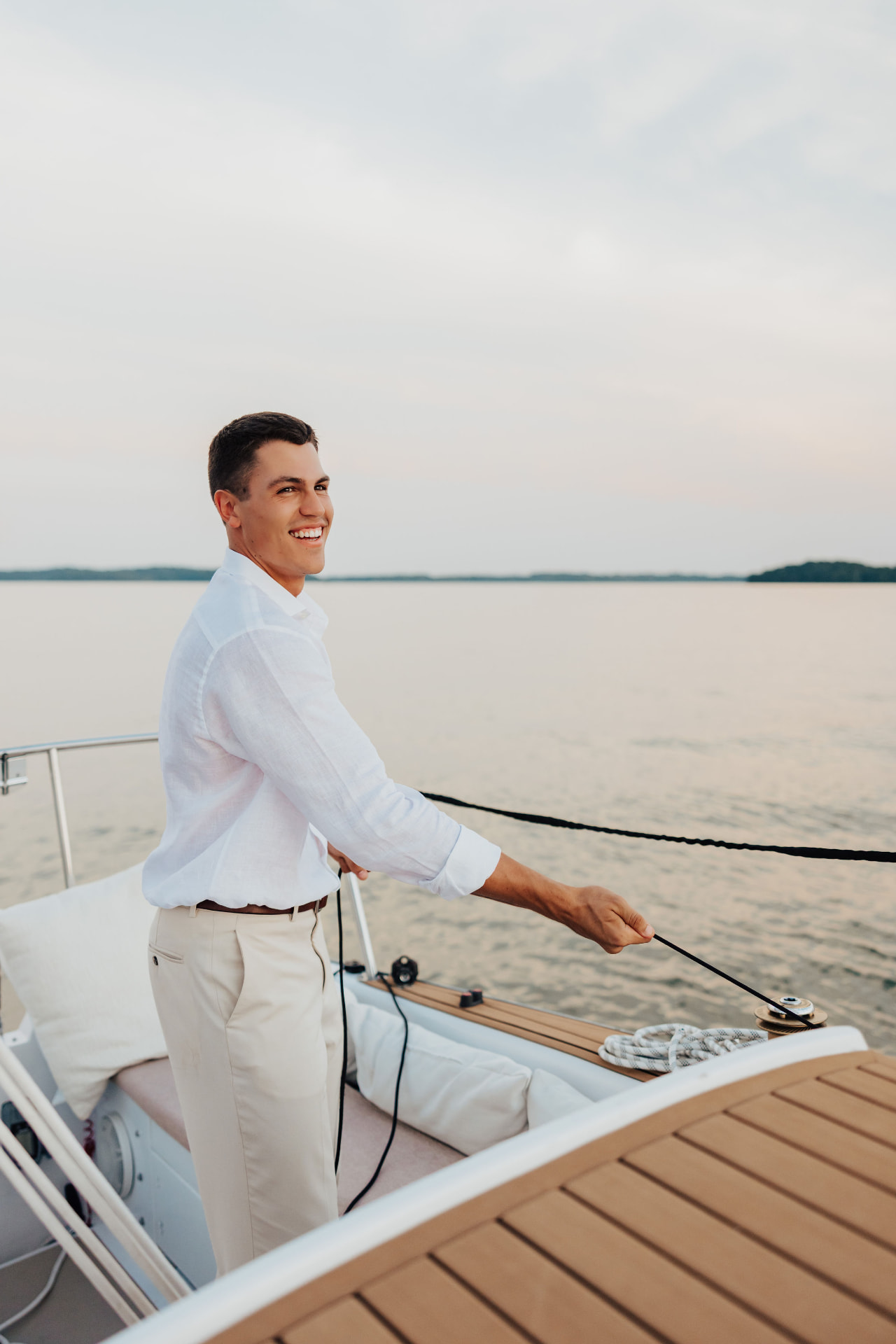 Westley on a sailboat, photographed by The Hunters Co.
