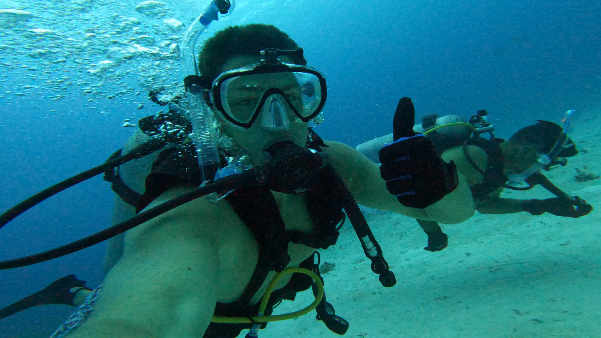 Underwater selfie with a thumbs up